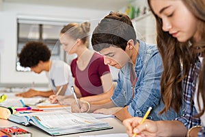 High school students doing exam in classroom
