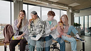 High school students eating sandwiches on lunch