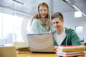 High school students with laptop in classroom