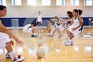 High School Students Playing Dodge Ball In Gym photo
