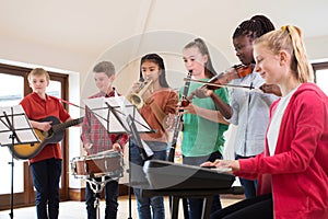 High School Students Playing In School Orchestra Together