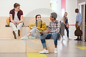 high school students sitting in lounge zone