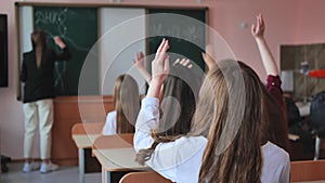 High school students stretch their hands in the lesson. Russian school.