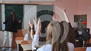 High school students stretch their hands in the lesson. Russian school.