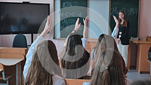 High school students stretch their hands in the lesson. Russian school.