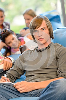 High-school students in study room reading writing photo