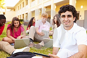 High School Students Studying Outdoors On Campus