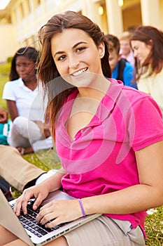 High School Students Studying Outdoors On Campus