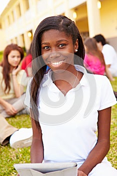 High School Students Studying Outdoors On Campus