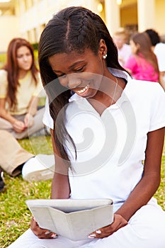 High School Students Studying Outdoors On Campus