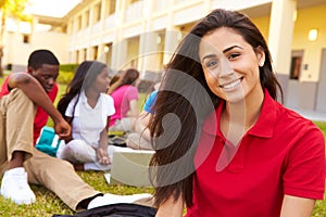 High School Students Studying Outdoors On Campus photo