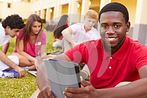 High School Students Studying Outdoors On Campus