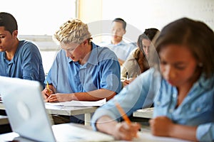 High School Students Taking Test In Classroom