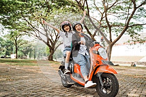 High school students with their friends while riding motorbikes photo