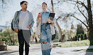 High school students walking and studying together outdoors on campus