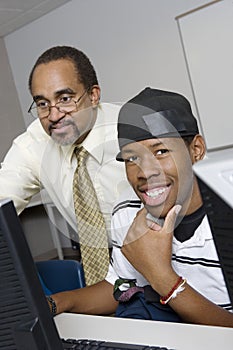 High School Teacher Helping Student