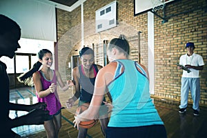 High school team playing basketball