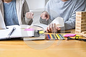 High school tutor or college student group sitting at desk in li