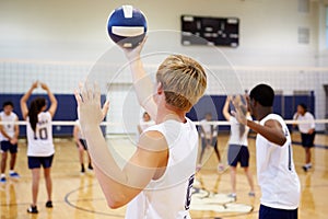 High School Volleyball Match In Gymnasium