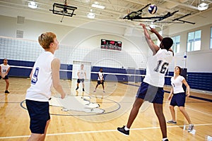 High School Volleyball Match In Gymnasium