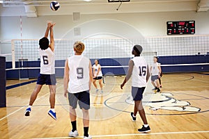 High School Volleyball Match In Gymnasium