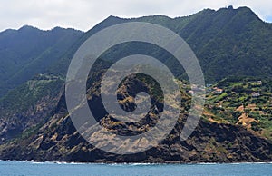 High seacliffs and black sand beaches in Porto da Cruz, Madeiraâ€™s northern coast