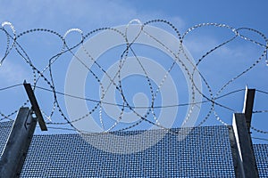 Security: Woven wire security fencing topped with razor wire. 3