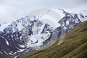 High snow capped mountains in the Tian Shan Mountain range of Kyrgyzstan