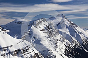 High Snowcapped Mountain Peaks Landscape above Columbia Icefields Parkway, Clear Blue Sky Background