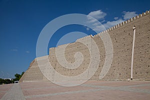 High solid brick walls of the Ark fortress in Bukhara in Uzbekistan. Tourism concept