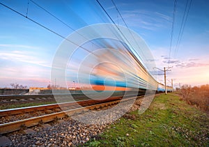 High speed blue passenger train in motion