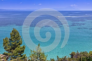 high-speed boat in the Aegean Sea near beautiful Fava sand beach near Vourvourou, Greek