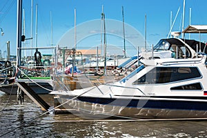 High-speed boat on the pier in sunny day.