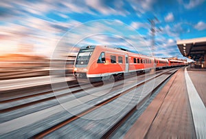 High speed commuter train in motion at the railway station