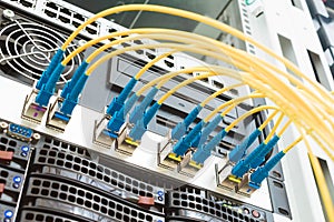 High-speed data transfer in a fiber-optic network. Communication equipment in the server room of the data center. Many fiber patch