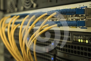 High-speed data transfer in a fiber-optic network. Communication equipment in the server room of the data center. Many fiber patch