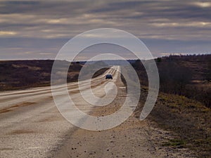 High-speed highway leaving towards the horizon through the flat terrain