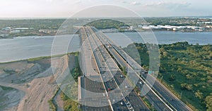 High-speed highway, with traffic road, the Alfred E. Driscoll Bridge across over the Raritan River. Aerial top view