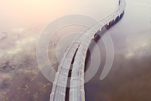 High-speed highway, traffic road, the bridge across over the bay sea river. Aerial top view