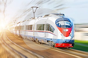 High-speed passenger train rushing through rail in Europe.