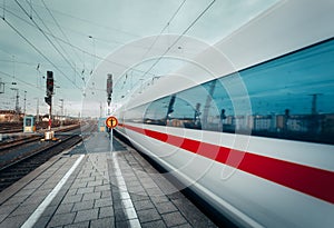 High speed passenger train on tracks in motion