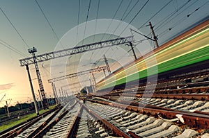 High speed passenger train on tracks with motion blur effect