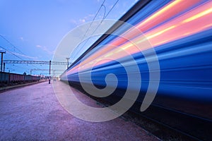 High speed passenger train on tracks with motion blur effect