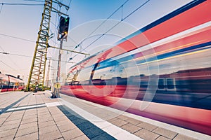 High speed train in motion on the railway station