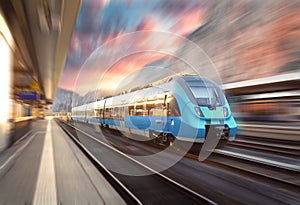 High speed train in motion at the railway station