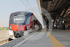 High-speed train is parked in the station waiting to pick up passengers