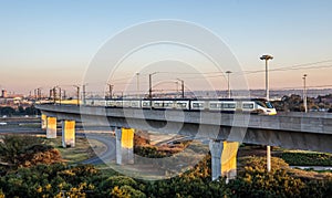 High speed train on a raised railway track