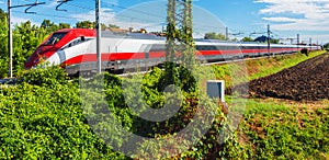 High-speed train traveling by railway