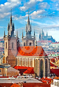 High spires towers of Tyn church in Prague city