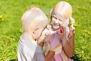 High-spirited children speaking on the toy phone